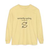 Currently cycling (the tank kind) long sleeve tee in Butter, front view with the navy cycle arrows and doodle medaka print