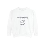 Currently cycling (the tank kind) premium crewneck sweatshirt in White, front view with the navy cycle arrows and doodle medaka print