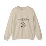 Currently cycling (the tank kind) crewneck sweatshirt in Sand, front view with the navy cycle arrows and doodle medaka print