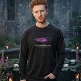 Man with copper red hair wearing the Nightshade logo long sleeve tee in Black, by a moonlit lily pond in old abbey ruins