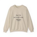 Rice fish, not a sushi order crewneck sweatshirt in Sand, front view with the navy print and one unimpressed hand-drawn medaka